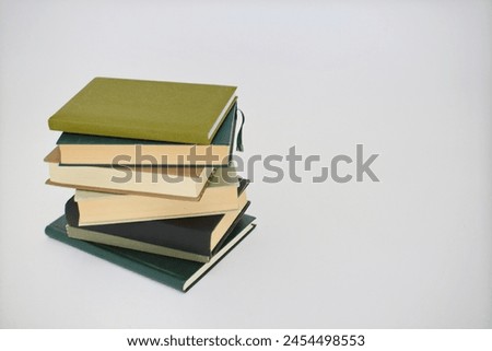 Stack of books on white,stack of books, green background. 3 d illustration  