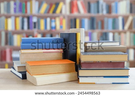 pile of books on the table in library, wonderful books for school, science and history, education