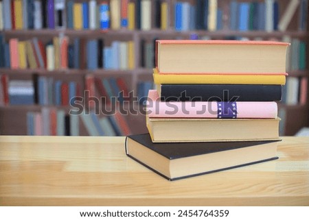 stack of books on the shelf in school