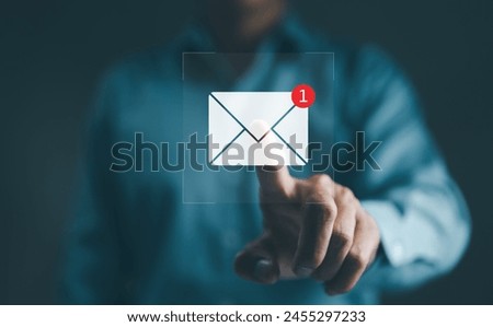 New email notification interaction concept. A person interacting with a floating digital interface showing a new email notification symbol, a concept for online communication. E-mail marketing,