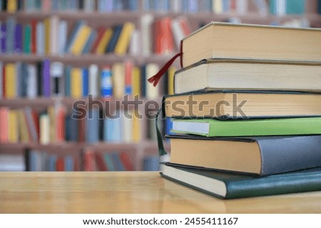 stack of green books onthe table in library, education