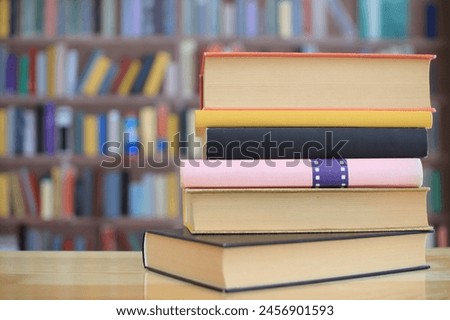 stack of books on the shelf in school