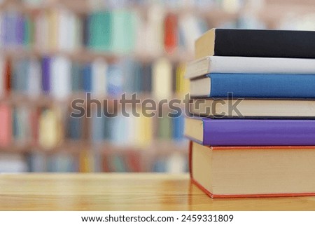 pile of colorful books on the table