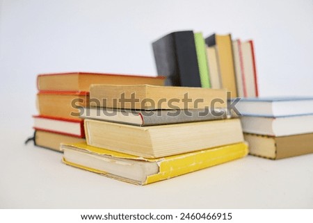 stack of books on wooden table in library, closeup. space for text