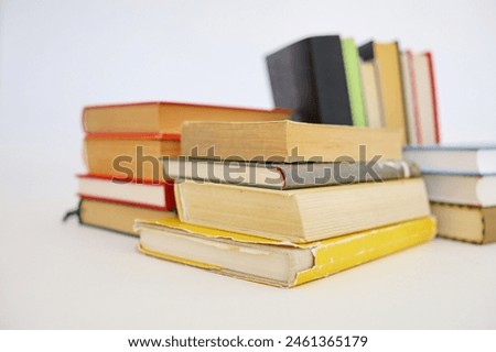 stack of books on wooden table in library, closeup. space for text