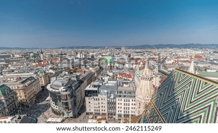 Panoramic aerial view of Vienna, Austria, from south tower of st. stephen's cathedral timelapse. City skyline with historic buildings rooftops from above at sunny day