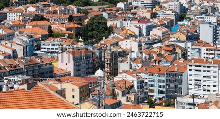 Aerial view of Lisbon cityscape, budlings with red roofs in Portugal, during sunny day.