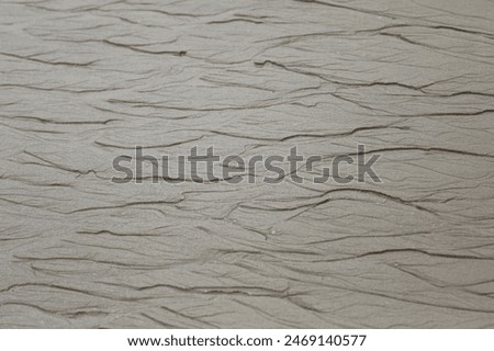 Patterns in beach sand during low tide