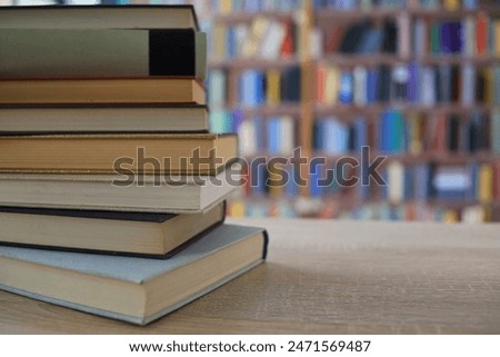 book, books on wooden table in library, education