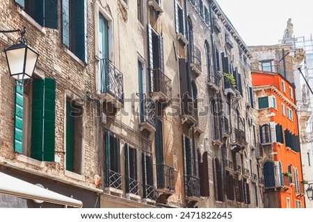 Row of Venice buildings with colorful facades. City's unique architectural charm