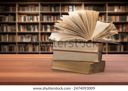 Book stack on the desk in public library