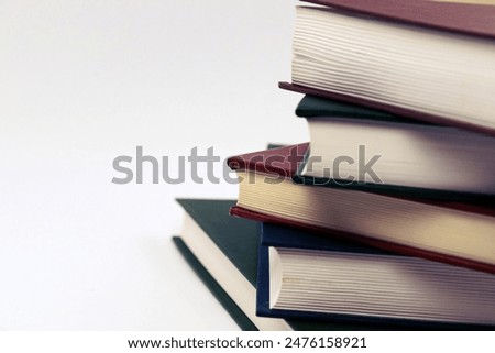 Book stack on a white background. Education concept side view close up