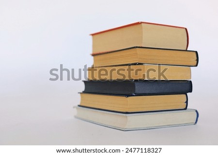 Beautiful books by famous writers on a white background, learning, knowledge, reading, schooling, studying, English language, Spanish language, Chinese language