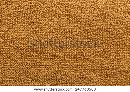 A fine texture of brown cotton bath towel