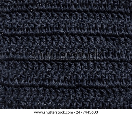 Black raffia crochet texture. Crocheted bags, clutches, hats, wallets. Eco-friendly handmade material.