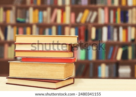 book, pile of old books on wooden shelves,stack of books on wooden table in library, stack of books in the store, blurred background, school, education, library, bookshop,