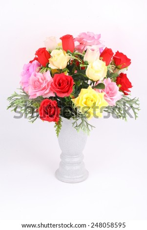 Multicolored arrangement of flowers in vase isolated on a white background
