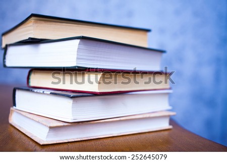 bale of book on the wooden table