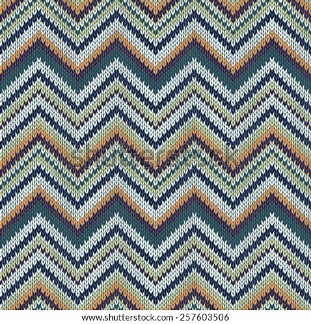 Seamless geometric ethnic spokes knitted pattern. White orange green color knitwear sample
