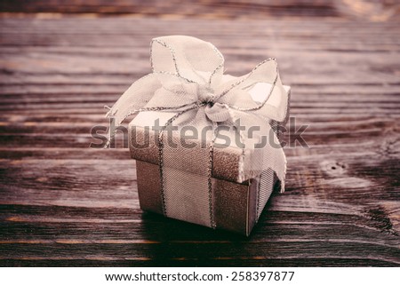 Gift box on wooden background - Vintage effect style pictures