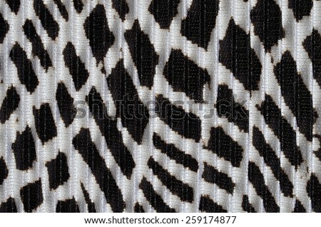 Black and white design on pleated material - abstract background