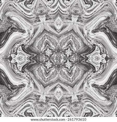 Repeating kaleidoscopic black and white background for design