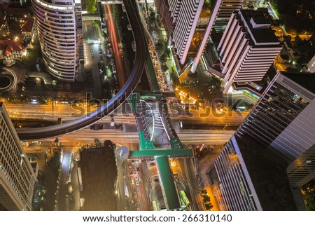 Birds eye view of Traffic in the business district, a modern building at night  
