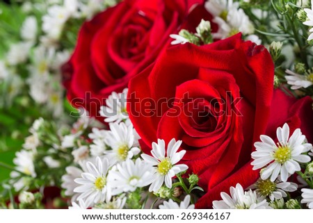 Red roses in bouquet decoration in wedding ceremony.