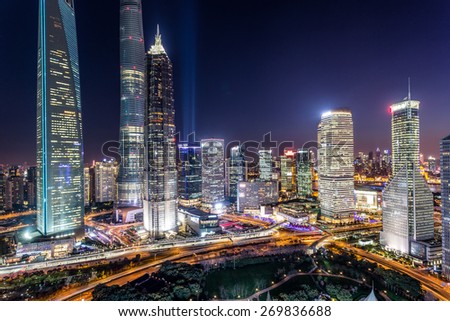 skyline,illuminated skyscrapers in modern city at night.