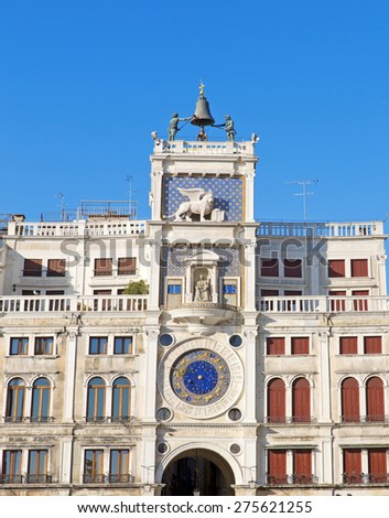 Zodiac clock. Clock Tower with winged lion and two moors striking the bell - early Renaissance (1497) building in Venice, located the north side of Piazza San Marco, Italy, Europe