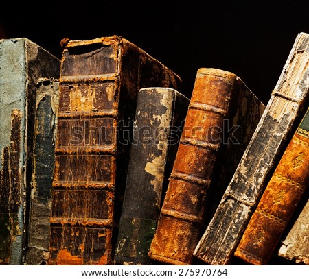 Old and ancient books on a shelf 