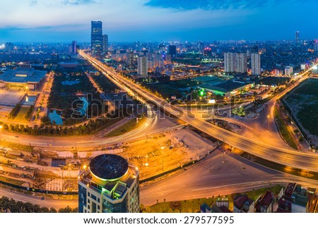 Aerial view of city at sunset. Hanoi cityscape at intersection Thang Long boulevard - Pham Hung street - Tran Duy Hung street 
