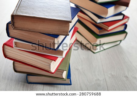 Stacks of books on wooden background