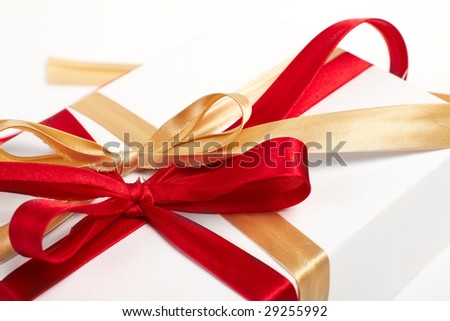 Big red, gold bow on white background
