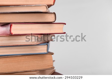 Heap of books on grey background