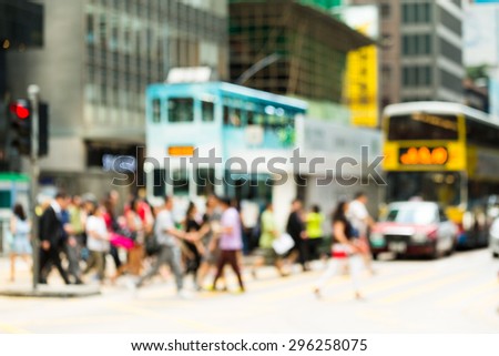 Blurred view of the pedestrian crossing the road