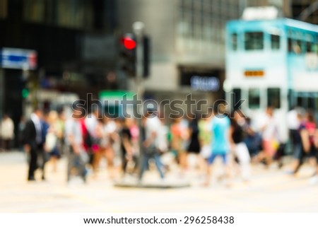 Blurred view of the people crossing the road