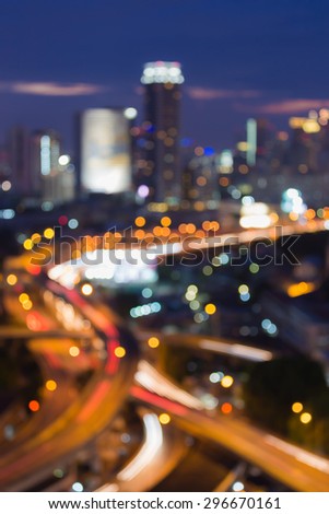 Bangkok city highway intersection, abstract blur bokeh city lights during twilight