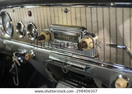 Interior of old retro vintage automobile or car with steering wheel and dashboard
