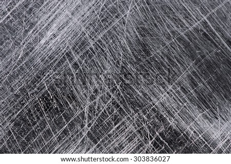 Scratches on the metal background.
