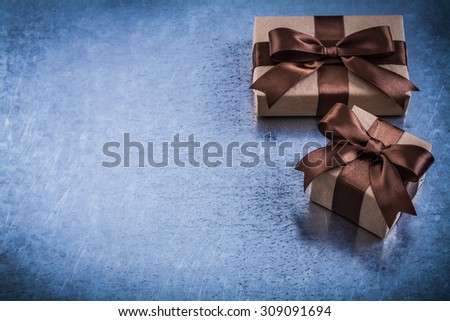 Copyspace of gift boxes with brown bows holidays concept.