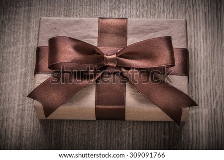 Boxed vintage gift container with brown ribbon celebration concept.