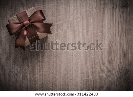 Packed vintage gift box on wooden board holiday concept copyspace.