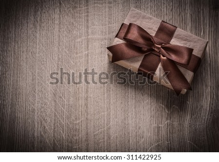 Packed vintage present box on wooden board holiday concept copyspace.