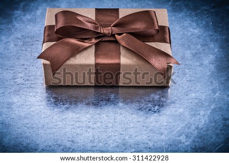 Packed gift boxes with brown ribbon horizontal version holidays concept.