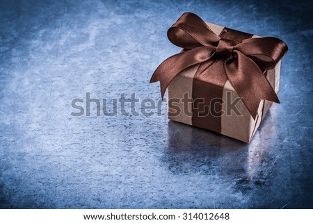 Wrapped present box with brown ribbon horizontal version.