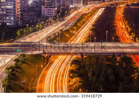 Light trails from vehicles on motorway at night Seoul,Korea
