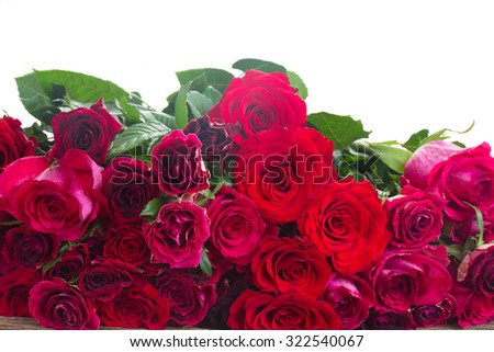 red and pink  roses on wooden border  isolated on white background
