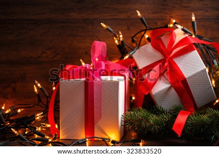 Christmas background. Gift boxes and christmas lights