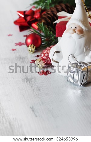 santa claus and christmas toys on a white wooden background. christmas idea. selective focus. copy space for you text
